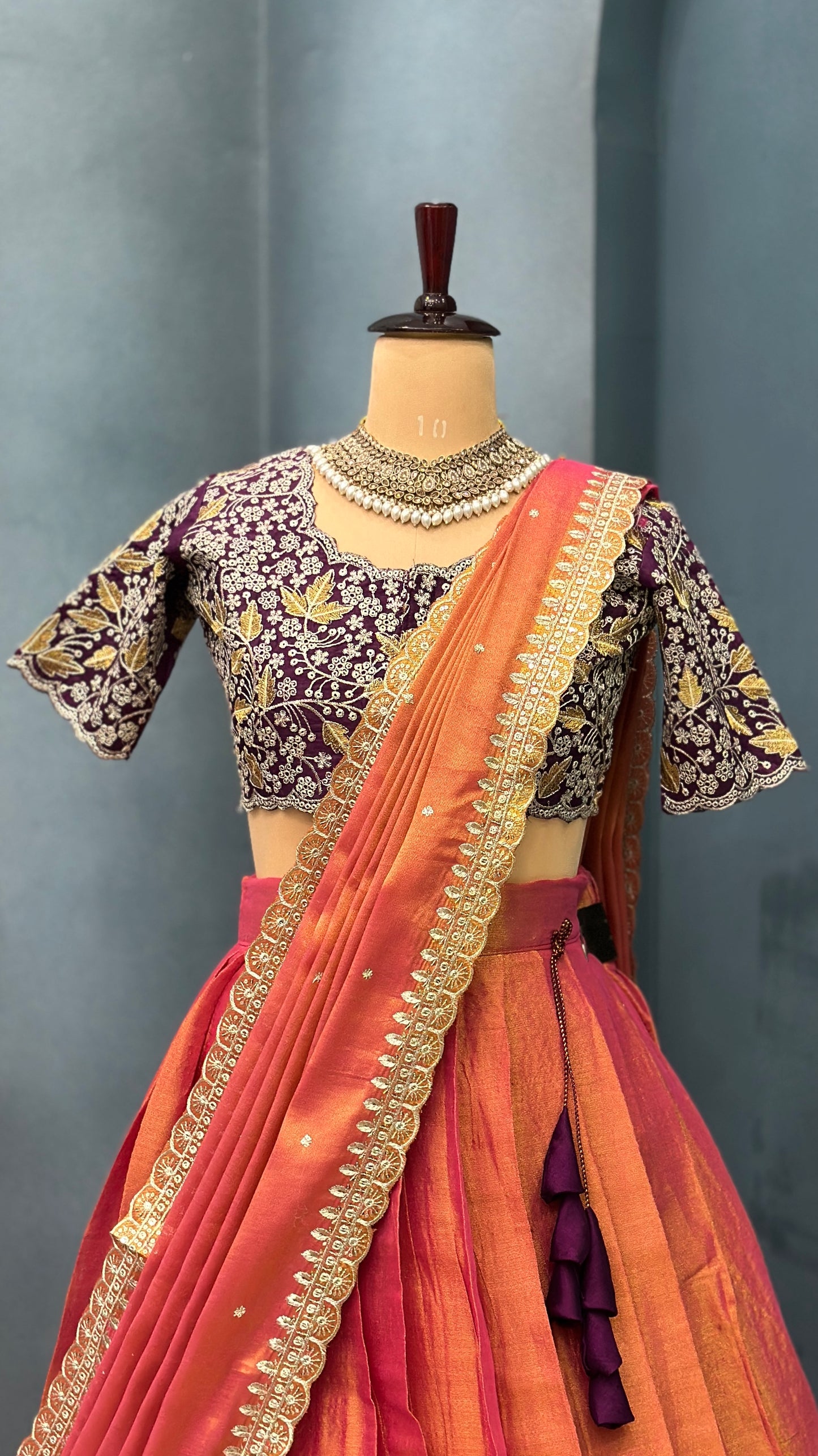 Royal Elegance in Every Pleat 👑
Dual-toned tissue silk lehenga