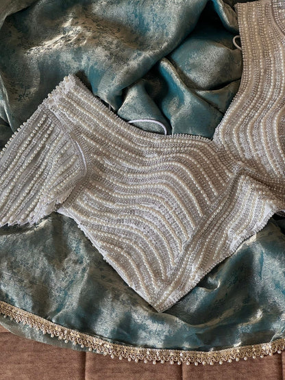 Premium space silk saree with lace and pearl work stitched blouse