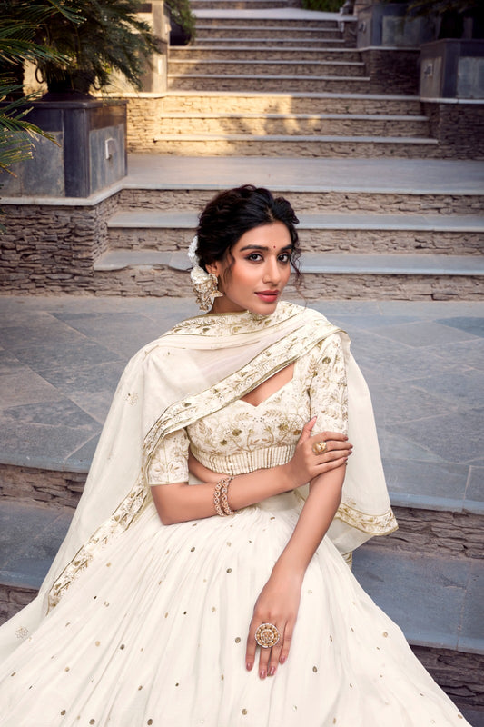 Off-white glam with intricate glossy dance lehenga