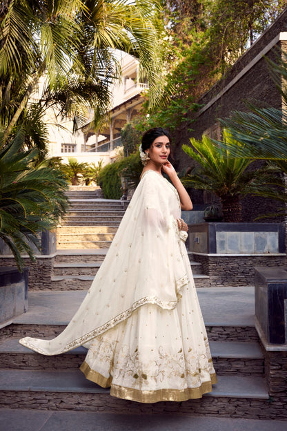 Off-white glam with intricate glossy dance lehenga