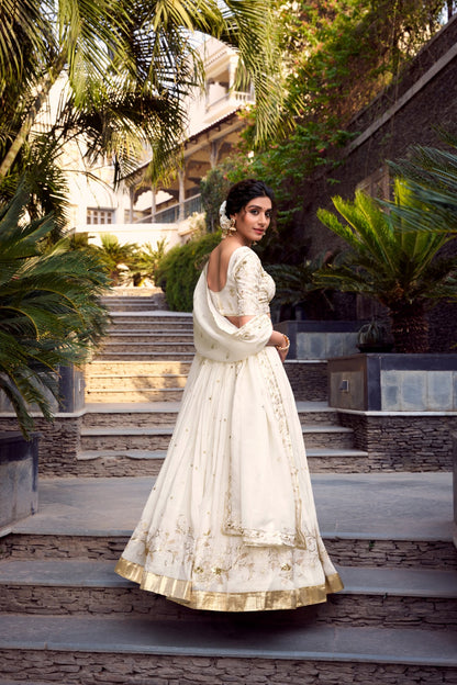 Off-white glam with intricate glossy dance lehenga